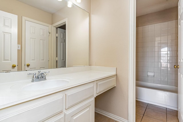 bathroom with vanity, tile patterned floors, and tiled shower / bath