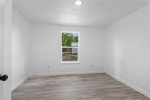 unfurnished room featuring light hardwood / wood-style flooring