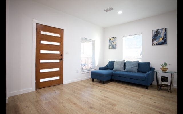 entrance foyer featuring light wood finished floors, baseboards, visible vents, and recessed lighting