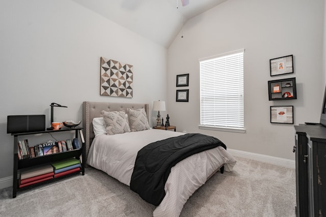 carpeted bedroom featuring vaulted ceiling and ceiling fan