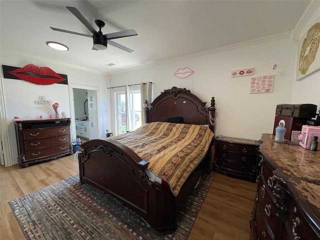 bedroom with wood-type flooring, ornamental molding, and ceiling fan