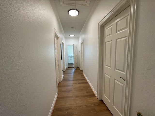 hall featuring crown molding and wood-type flooring