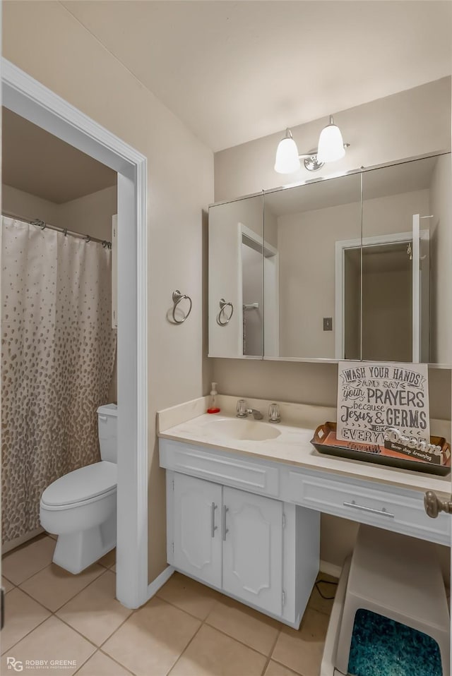 full bath with toilet, tile patterned floors, and vanity