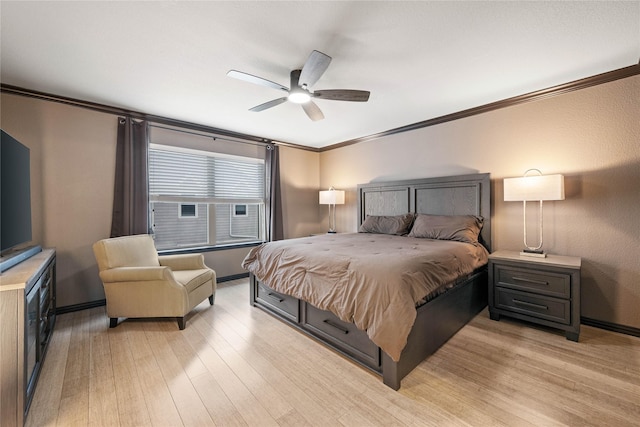 bedroom with crown molding, ceiling fan, and light wood-type flooring