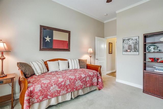 bedroom featuring crown molding, carpet, ceiling fan, and baseboards