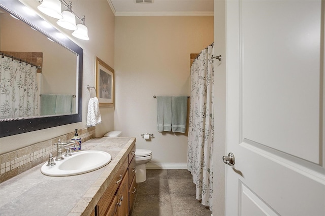 bathroom featuring vanity, toilet, tile patterned floors, backsplash, and ornamental molding