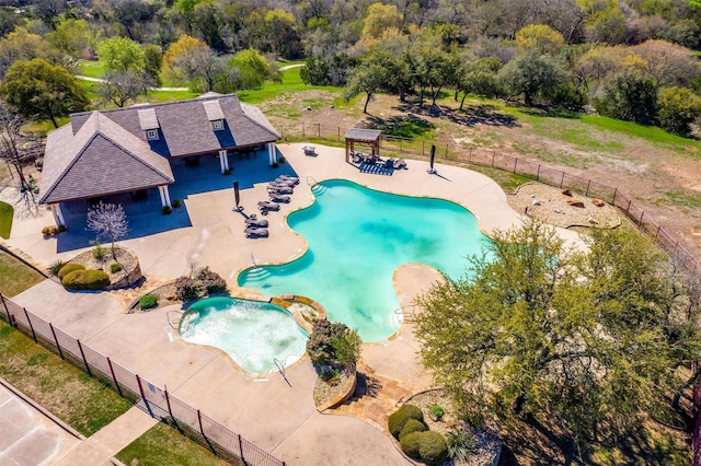 community pool featuring fence, a pergola, a gazebo, a patio area, and a community hot tub