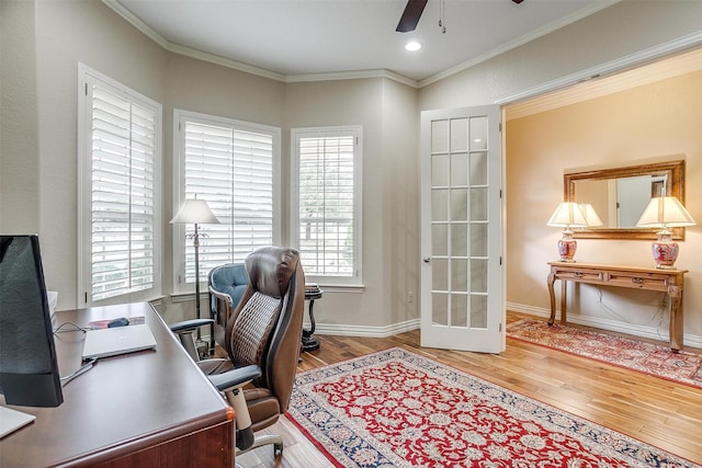 home office with crown molding, baseboards, ceiling fan, and wood finished floors
