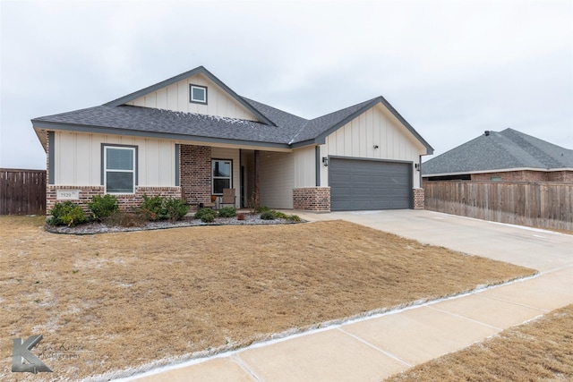 view of front facade with a garage and a front yard