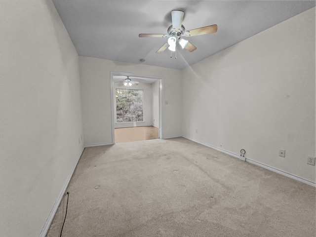 unfurnished room with light colored carpet