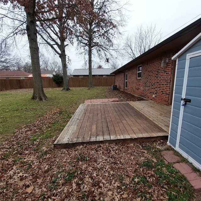 wooden deck with a lawn