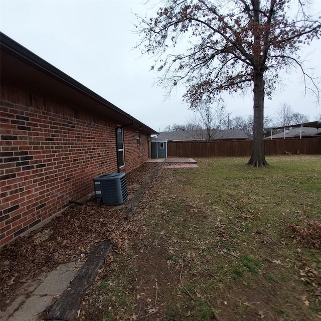 view of yard with central AC unit