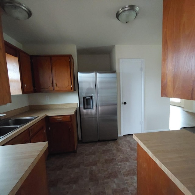 kitchen with sink and stainless steel fridge