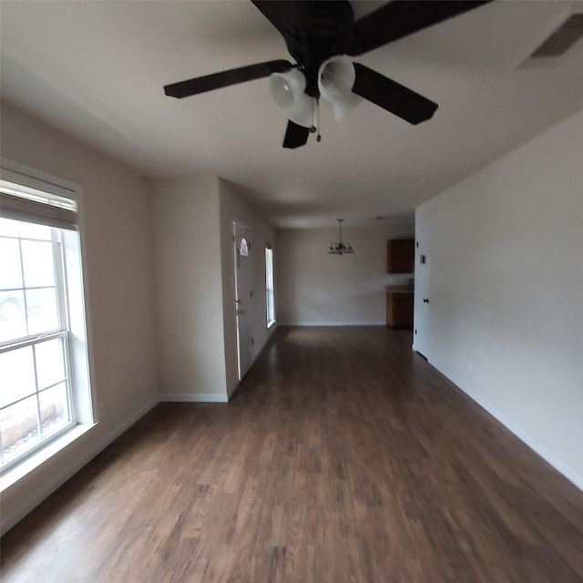 empty room featuring dark hardwood / wood-style floors and ceiling fan