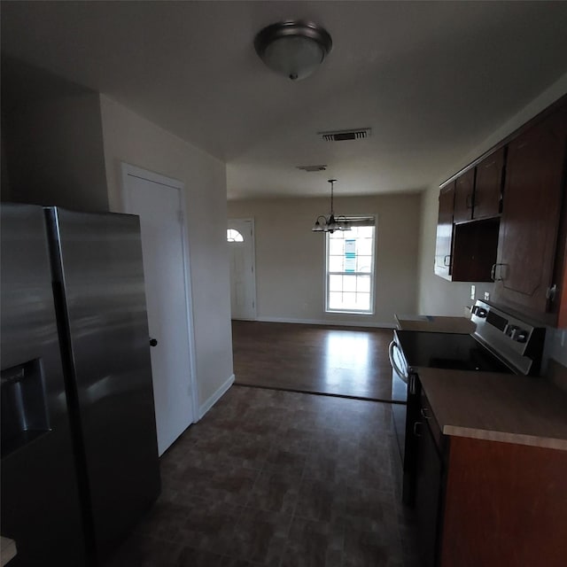 kitchen with pendant lighting, appliances with stainless steel finishes, an inviting chandelier, dark brown cabinets, and dark hardwood / wood-style floors