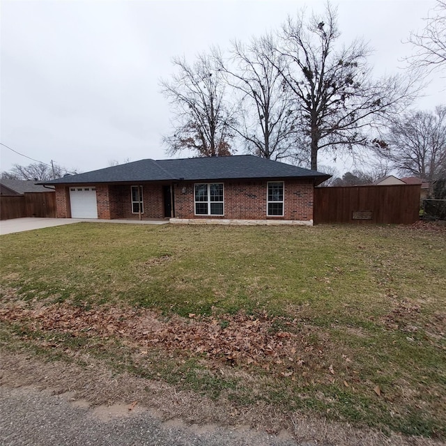 ranch-style house featuring a garage and a front yard