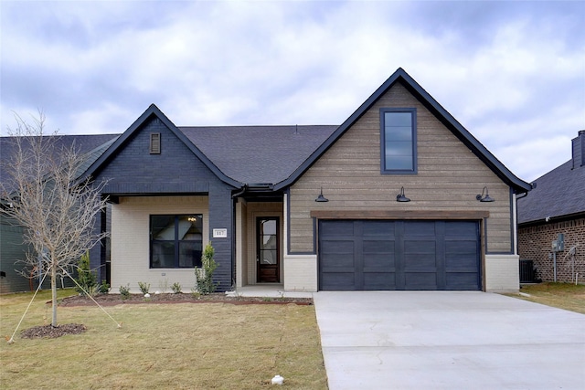 view of front of home featuring a front yard and central air condition unit