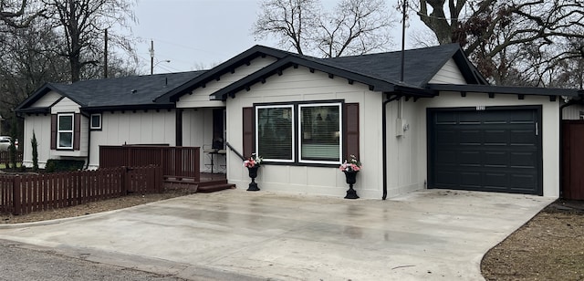 ranch-style home featuring a garage