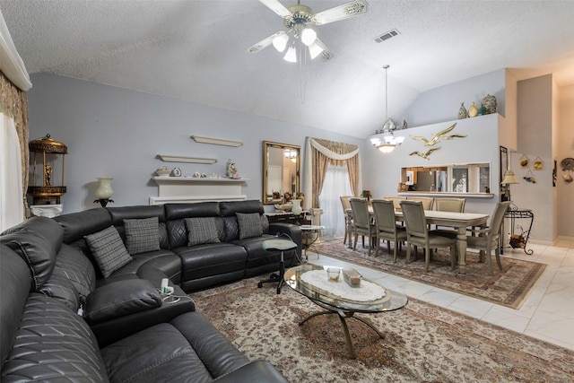 living room featuring ceiling fan with notable chandelier, vaulted ceiling, and a textured ceiling