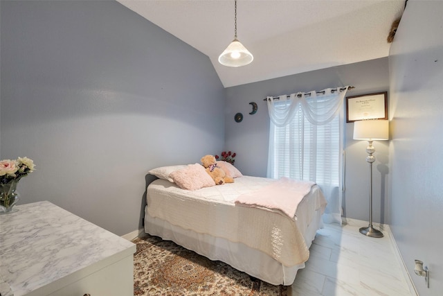 bedroom featuring lofted ceiling