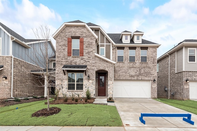 view of front of home with a garage and a front yard