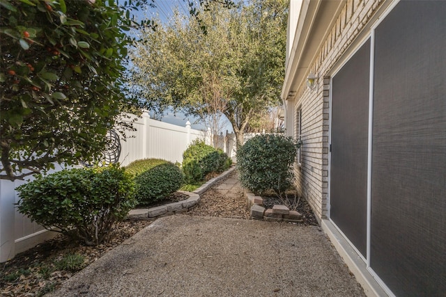 view of yard featuring a patio and fence