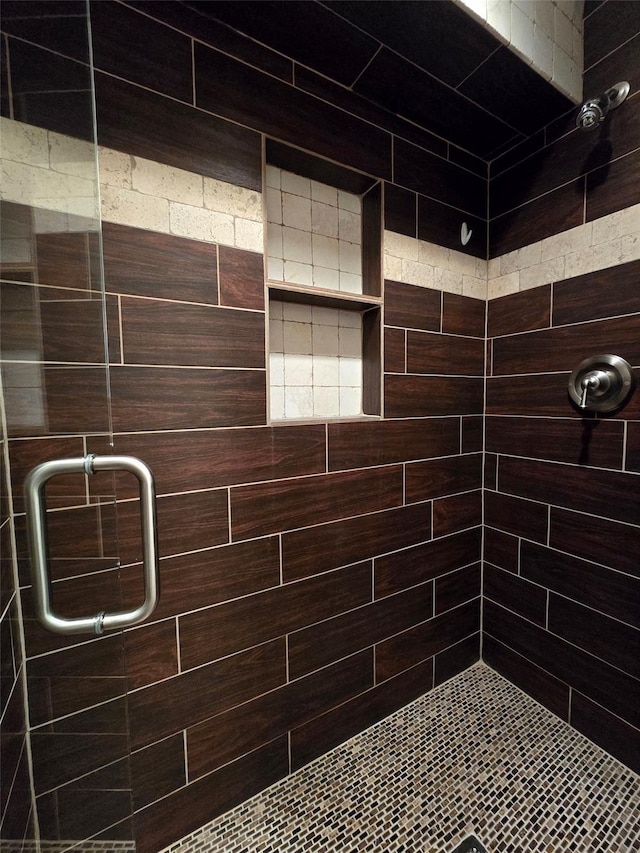 bathroom featuring a shower stall