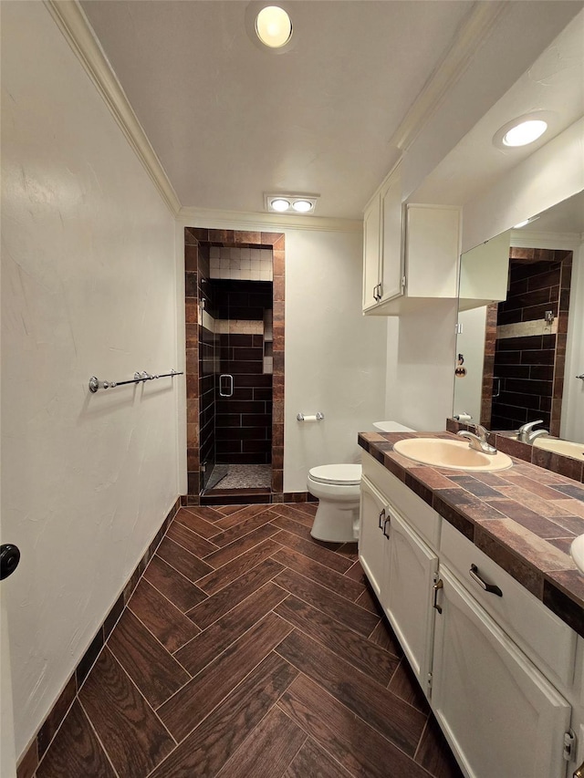 bathroom featuring baseboards, toilet, crown molding, a shower stall, and a fireplace