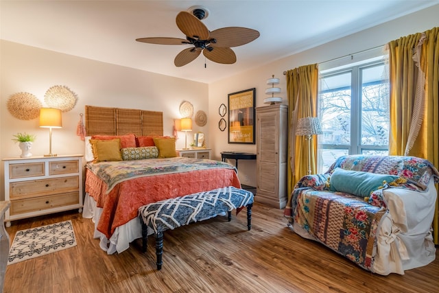 bedroom featuring hardwood / wood-style flooring and ceiling fan