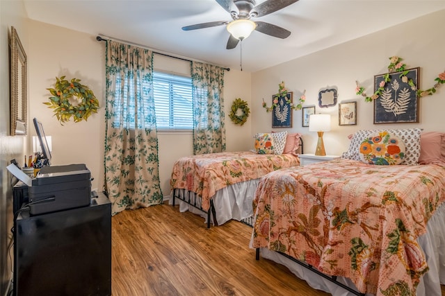 bedroom featuring wood-type flooring and ceiling fan