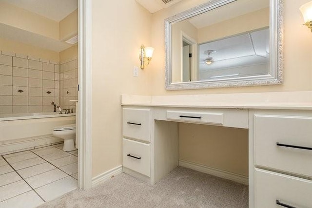 full bathroom featuring vanity, toilet, tiled shower / bath combo, and tile patterned flooring