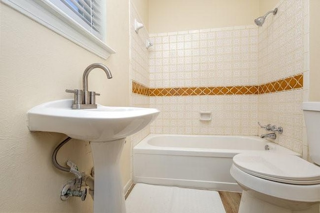 bathroom featuring hardwood / wood-style flooring and toilet