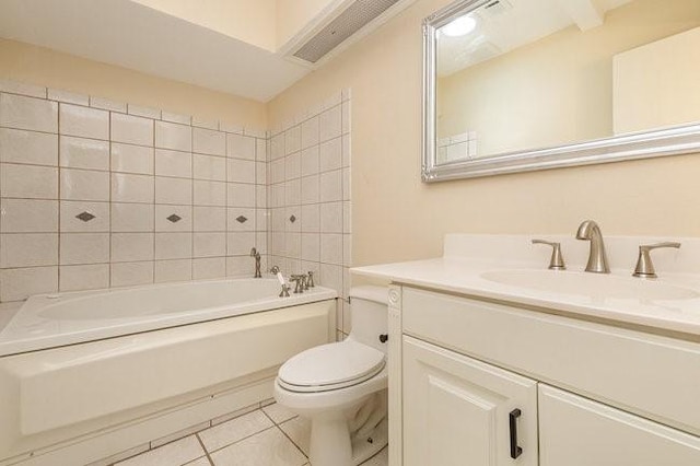 full bathroom featuring vanity, tiled shower / bath, tile patterned floors, and toilet