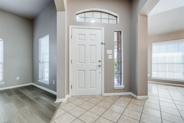 foyer featuring light tile patterned floors