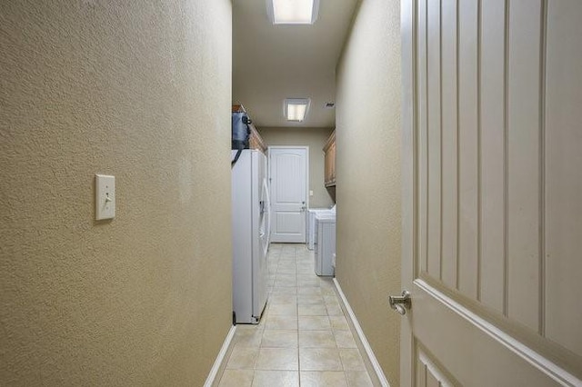 hallway featuring light tile patterned floors