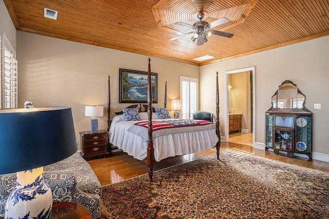 bedroom featuring hardwood / wood-style flooring, ornamental molding, and wooden ceiling