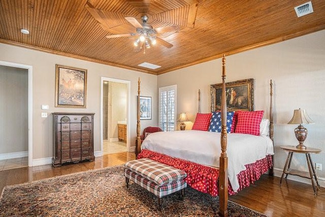 bedroom with crown molding, wood ceiling, ensuite bath, ceiling fan, and hardwood / wood-style floors