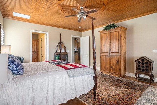 bedroom with crown molding, hardwood / wood-style flooring, and wooden ceiling