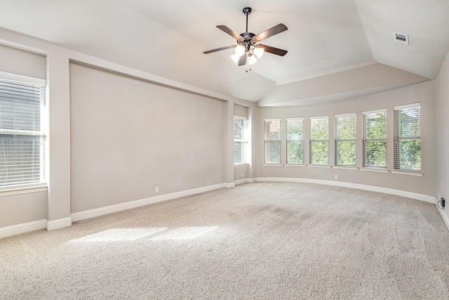 spare room with carpet, lofted ceiling, and ceiling fan