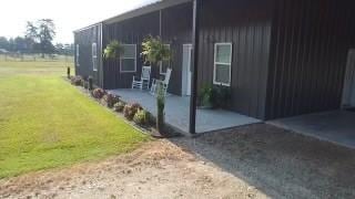 view of side of property featuring a yard