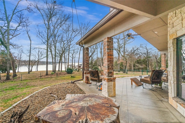 view of patio with a water view