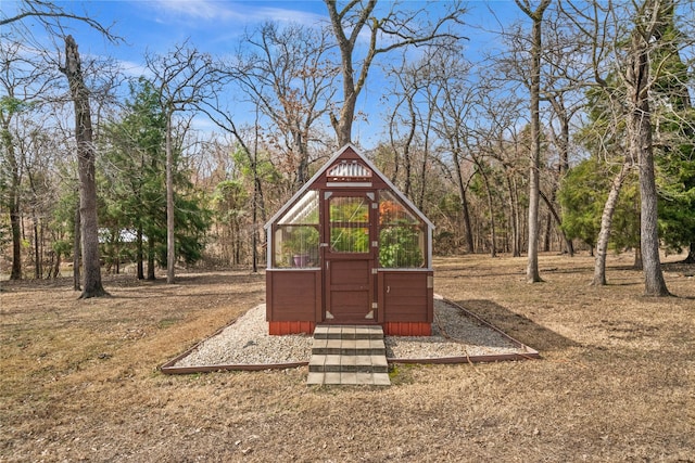 view of playground with an outbuilding