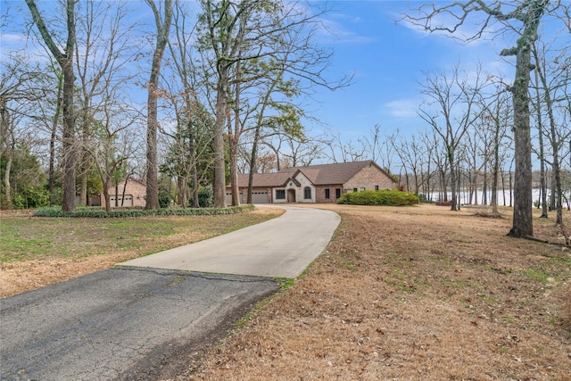 view of front of home featuring a water view and a front yard