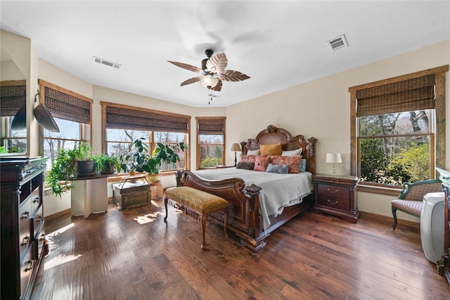 bedroom with dark hardwood / wood-style flooring