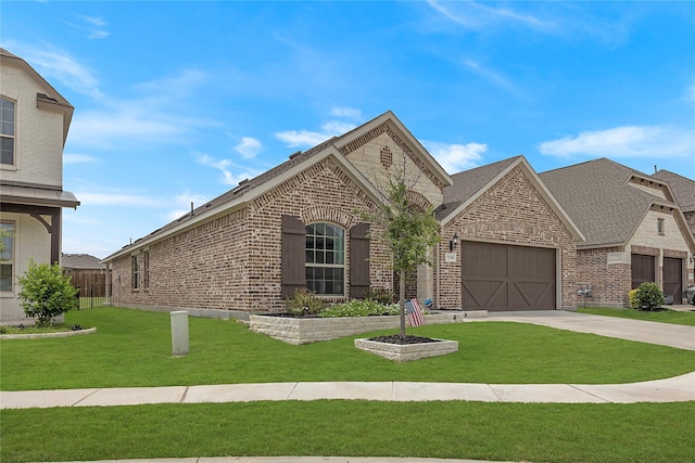 view of front facade with a garage and a front yard