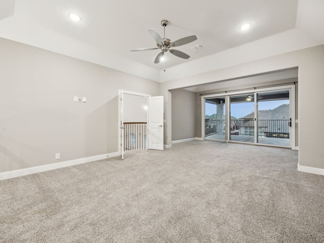 unfurnished living room with ceiling fan and carpet