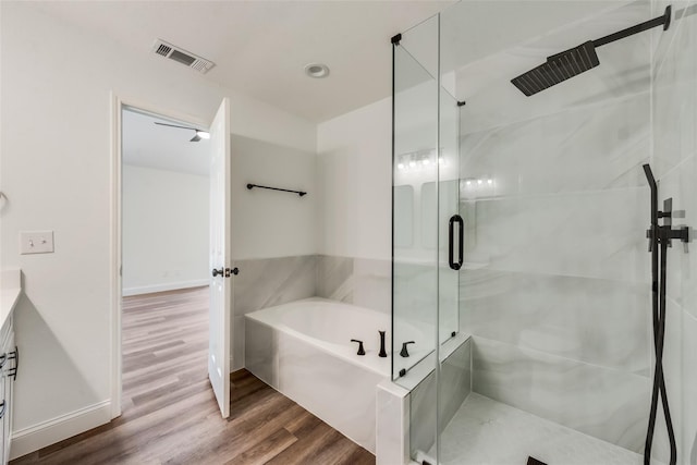 bathroom featuring vanity, shower with separate bathtub, and wood-type flooring