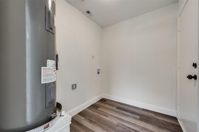 laundry room featuring wood-type flooring, electric water heater, and washer hookup