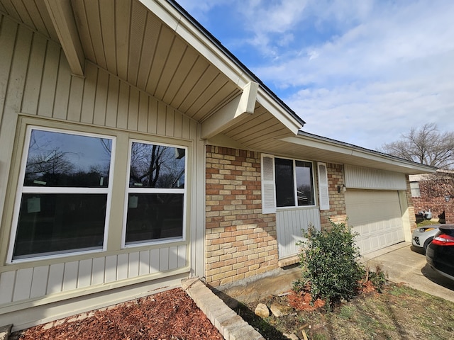 doorway to property with a garage