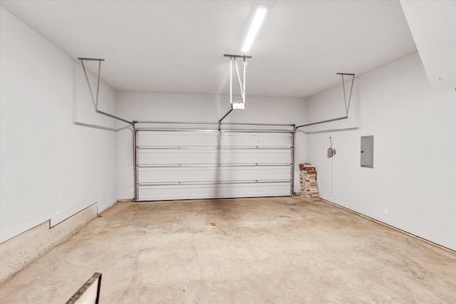 garage featuring a garage door opener and electric panel